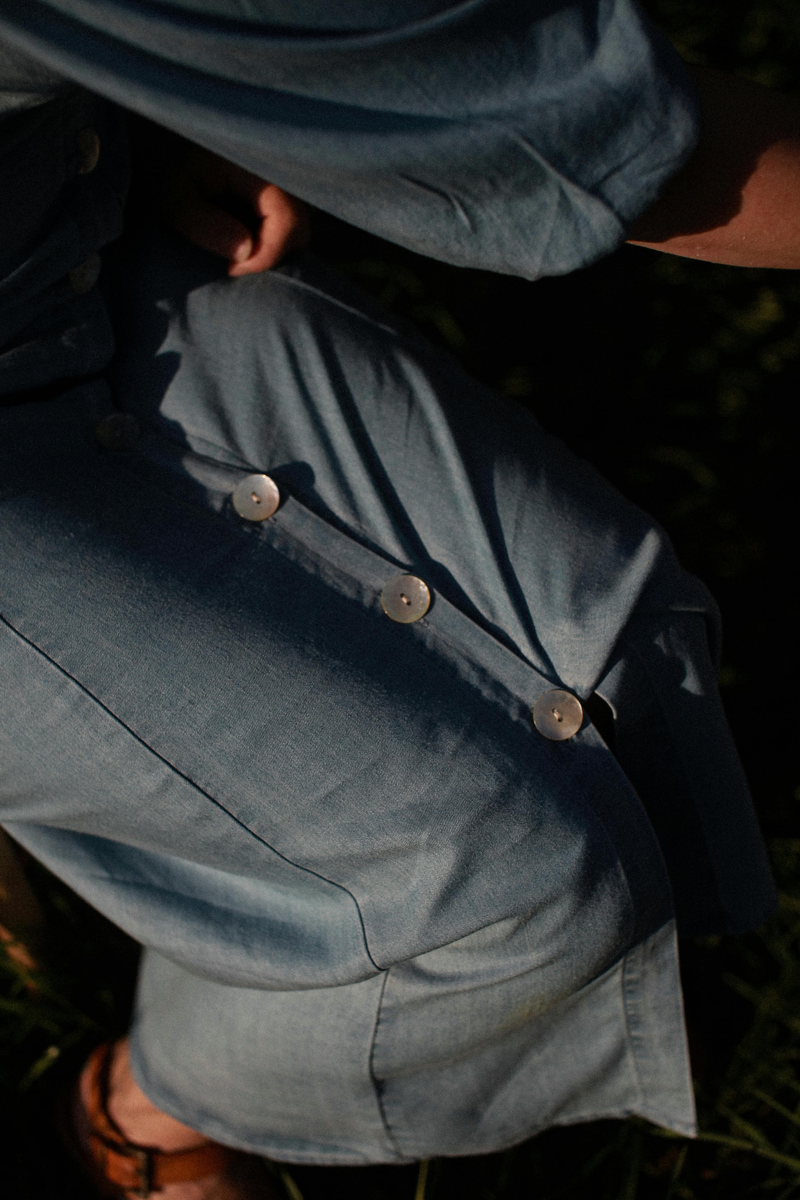 Close-up of naturally dyed cotton fabric catching sunlight.